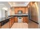 Modern kitchen with stainless steel appliances and granite countertops at 1801 S Dunkirk St # 303, Aurora, CO 80017