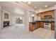 Kitchen with stainless steel appliances and wood cabinetry at 1801 S Dunkirk St # 303, Aurora, CO 80017