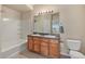 Bathroom features double sinks and a bathtub at 1801 S Dunkirk St # 303, Aurora, CO 80017