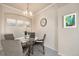 Small dining area with table and four chairs at 1801 S Dunkirk St # 303, Aurora, CO 80017