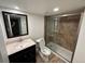Basement bathroom with walk-in shower and updated vanity at 3060 S Hannibal St, Aurora, CO 80013