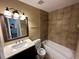 Updated bathroom with a tub and vanity with modern finishes at 3060 S Hannibal St, Aurora, CO 80013