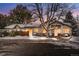 Townhouse exterior with snowy landscaping at dusk at 2951 S Walden Ct, Aurora, CO 80013