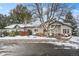 Exterior of the home showing a cozy townhome with a snowy front yard at 2951 S Walden Ct, Aurora, CO 80013