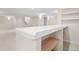 Basement wet bar with tile countertop and shelving at 2951 S Walden Ct, Aurora, CO 80013