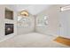 Bright living room featuring a fireplace, vaulted ceilings, and ample natural light at 2951 S Walden Ct, Aurora, CO 80013