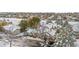 Aerial view of the townhome community in winter, showcasing snowy rooftops and landscaping at 2951 S Walden Ct, Aurora, CO 80013
