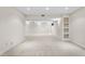 Spacious finished basement with built-in shelving and carpeting at 2951 S Walden Ct, Aurora, CO 80013