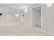 Finished basement showcasing a large open area and access to other rooms at 2951 S Walden Ct, Aurora, CO 80013