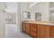 Primary bathroom with double vanity and access to walk-in closet at 2951 S Walden Ct, Aurora, CO 80013