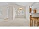Open living room with high ceilings and access to kitchen at 2951 S Walden Ct, Aurora, CO 80013