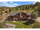 Luxury log home with expansive decks and mountain views at 14088 Spirit Valley Trl, Conifer, CO 80433