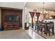 Bright dining room with a wooden table and chairs at 14389 E 101St Pl, Commerce City, CO 80022