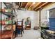 Unfinished basement area with shelving for storage at 14389 E 101St Pl, Commerce City, CO 80022