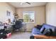Home office or guest bedroom with built-in shelving and a comfortable sofa bed at 14389 E 101St Pl, Commerce City, CO 80022
