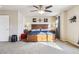 Main bedroom with king bed, ceiling fan, and ample sunlight at 14389 E 101St Pl, Commerce City, CO 80022