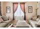 Living room with large window and seating at 14389 E 101St Pl, Commerce City, CO 80022