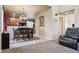 Open dining area with kitchen views and wooden table set at 14389 E 101St Pl, Commerce City, CO 80022