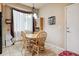 Cozy dining area with a charming hutch and wood table set at 14389 E 101St Pl, Commerce City, CO 80022