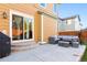 Backyard patio with seating area and grill at 14389 E 101St Pl, Commerce City, CO 80022