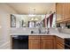 Eat-in kitchen with a breakfast bar, overlooking the living and dining areas at 14389 E 101St Pl, Commerce City, CO 80022