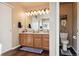 Double vanity bathroom with a large mirror and plenty of counter space at 14389 E 101St Pl, Commerce City, CO 80022