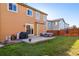 Spacious backyard with patio, grill, and grassy area at 14389 E 101St Pl, Commerce City, CO 80022