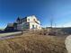 Two-story house with gray siding, and a wooden fence at 5500 Riverbend Ave, Firestone, CO 80504