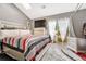 Spacious bedroom with plush bed, access to patio, and plenty of natural light at 1148 S Ventura Cir # E, Aurora, CO 80017