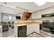 Open kitchen with view to living room at 1148 S Ventura Cir # E, Aurora, CO 80017