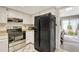 Galley kitchen with stainless steel appliances at 1148 S Ventura Cir # E, Aurora, CO 80017