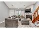 Spacious living room with fireplace and vaulted ceilings at 1148 S Ventura Cir # E, Aurora, CO 80017