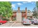 Townhouse exterior with parking and landscaping at 1148 S Ventura Cir # E, Aurora, CO 80017