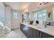Double vanity bathroom with a large mirror and walk-in shower at 305 W Charles St, Superior, CO 80027