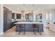 Modern kitchen with large island, dark cabinets, and quartz countertops at 305 W Charles St, Superior, CO 80027