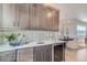 Stylish wet bar featuring gray cabinets and wine cooler at 305 W Charles St, Superior, CO 80027