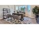 Home office with large window, built-in shelves, and a desk at 305 W Charles St, Superior, CO 80027