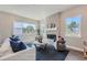 Living room featuring a fireplace, large windows, and comfortable seating at 305 W Charles St, Superior, CO 80027