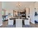 Open concept dining room with modern light fixture and adjacent kitchen at 305 W Charles St, Superior, CO 80027