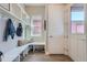 Bright entryway with built-in bench, cubbies, and coat hooks at 305 W Charles St, Superior, CO 80027