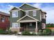 Two-story craftsman style home with green exterior at 305 W Charles St, Superior, CO 80027