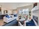 Spacious living area with a fireplace, comfortable seating, and kitchen views at 305 W Charles St, Superior, CO 80027