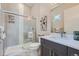 Modern bathroom with a walk-in shower, vanity, and toilet at 305 W Charles St, Superior, CO 80027