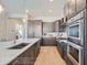Modern kitchen with dark cabinetry and stainless steel appliances at 305 W Charles St, Superior, CO 80027