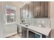Modern wet bar with gray cabinets and quartz countertops at 305 W Charles St, Superior, CO 80027