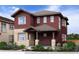 Two-story home with red exterior and stone accents at 305 W Charles St, Superior, CO 80027