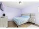 Bright bedroom with light walls, large bed, and plenty of storage at 3924 Alamosa Ct, Brighton, CO 80601