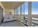 Bright sunroom features a comfy sofa and expansive windows offering scenic views at 300 S Clinton St # 8C, Denver, CO 80247