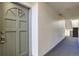 Clean hallway with carpeted floors and doors to apartments at 10211 Ura Ln # 7-201, Thornton, CO 80260