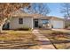 Ranch style home with landscaped yard and attached garage at 3090 S Eudora St, Denver, CO 80222